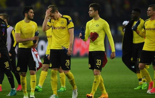 Dortmund's players react after their UEFA Champions League 1st leg quarter-final football match against Monaco in Dortmund, western Germany on April 12, 2017
