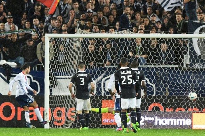 Lyon's Emanuel Mammana (L) scores a late goal during their match against Bordeaux on March 3, 2017