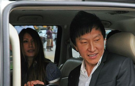 Singapore prosecutors are seeking a review of a court ruling which slashed the jail term of a showbiz pastor Kong Hee (R) who misused millions in church funds to promote his wife Ho Yeow Sun (L)'s music career, amid public outcry