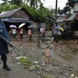An armed policeman stands guard during a visit of former UN secretary general Kofi Annan to the Aung Mingalar displacement camp for the minority Muslim Rohingya, in Sittwe, Myanmar in September 2016