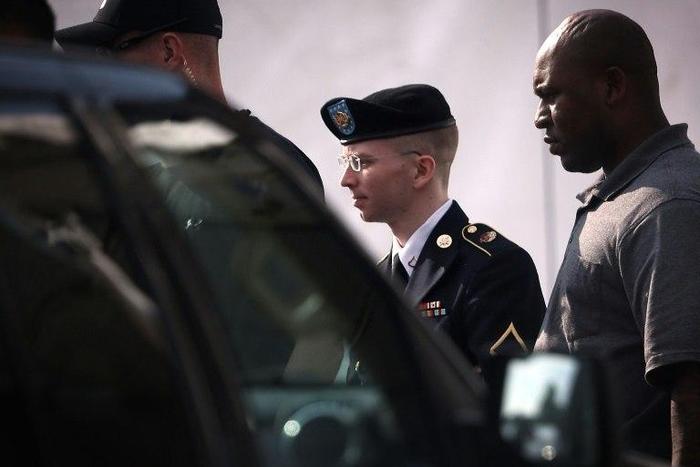 Chelsea Manning (C) was sentenced to 35 years in prison for sending hundreds of thousands of classified government documents to Wikileaks