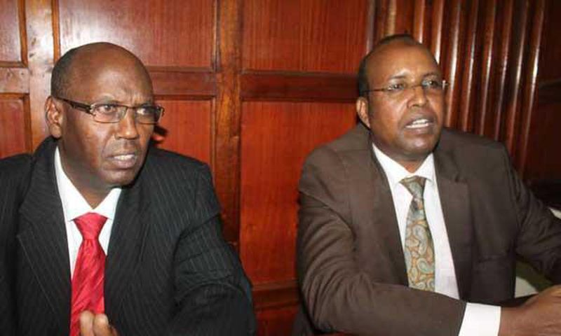Former NYS Deputy Director General Adan Harakhe (right) with former Devolution and Planning ministry administrator Hassan Noor Hassan in a Nairobi court on November 28, 2016.
