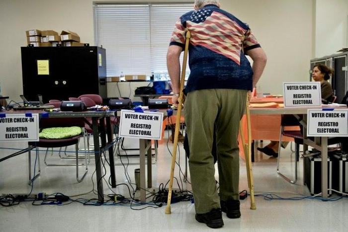 A man checks-in at the Activity Center at Bohrer Park during early voting on October 28, 2016 in Gaithersburg, Maryland