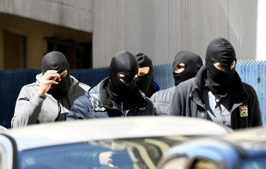 Police found guns, explosives and an IS flag at the suspects' flat