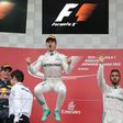 Nico Rosberg (C) claimed his first Suzuka win from pole as Lewis Hamilton took third after a dreadful start