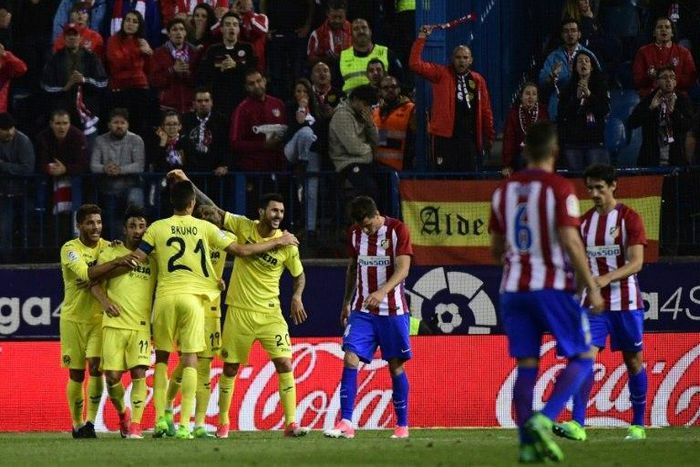 Villarreal's players celebrate after midfielder Roberto Soriano scored during the Spanish league football match against Atletico Madrid April 25, 2017