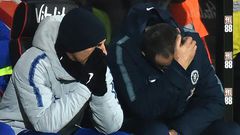 Chelsea boss Maurizio Sarri (R) holds his head in frustration
