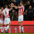 Stoke City's striker Peter Crouch (R) celebrates with teammates after scoring his team's first goal during the English Premier League football match against Everton February 1, 2017