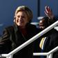 US Democratic presidential nominee Hillary Clinton waves as she boards her campaign plane at the Westchester County Airport in White Plains, New York, on October 31, 2016