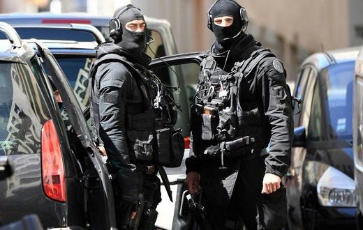Members of the French RAID police search the home of one of the two men arrested in Marseille on April 18, 2017 in Marseille, on suspicion of planning an "imminent" attack plot just days from the presidential polls