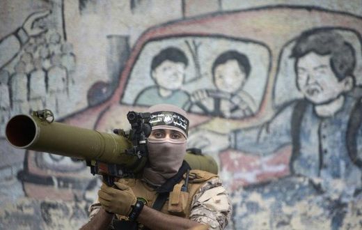 A member of Hamas's military wing takes part in a rally in Gaza City on December 14, 2016, marking the movement's 29th anniversary