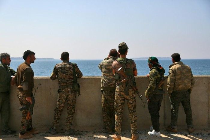 Members of the US-backed Syrian Democratic Forces stand on the Tabqa dam partially recaptured during their drive on the Islamic State group's stronghold in nearby Raqa