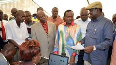 Cord leaders Raila Odinga (right) and Kalonzo Musyoka inspect an IEBC registration centre at Jomo Kenyatta Sports Grounds in Kisumu.