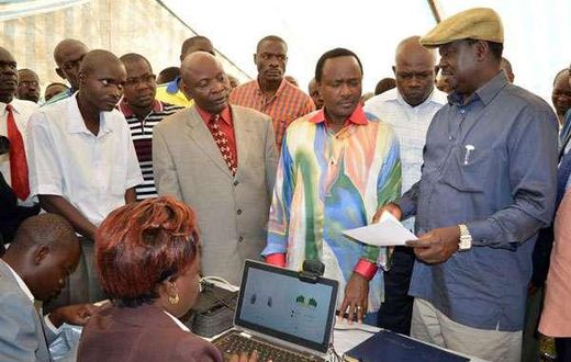 Cord leaders Raila Odinga (right) and Kalonzo Musyoka inspect an IEBC registration centre at Jomo Kenyatta Sports Grounds in Kisumu.