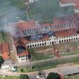 Smoke billows from Bauru's Penitentiary Progression Center (CPP3), 330 km from Sao Paulo, Brazil, on January 24, 2017 after 62 inmate escaped from the semi-open detention centre after setting fire to a pavilion