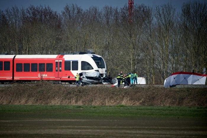 Emergency personnel work at the scene of a train crash on March 27, 2017 near Harlingen, northern Netherlands
