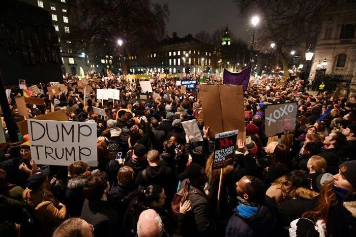 A crowd in London chanted "Shame on you Theresa May"