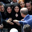 President Recep Tayyip Erdogan greets supporters as Turks vote on whether to grant him extended powers