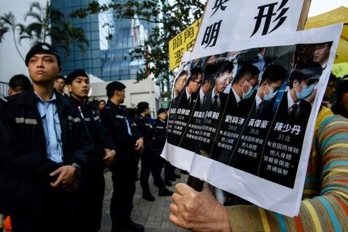 Seven Hong Kong police officers are jailed for two years after being found guilty of assualt on a pro-democracy demonstrator in 2014