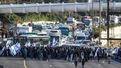 Israelis of Ethiopian origin block Tel Aviv highway as they protest against police violence and racism after an officer shot a young community member dead