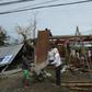 A family fix the roof of their house, damaged at the height of typhoon Haima, in Ilagan town, Isabela province, north of Manila, on October 20, 2016