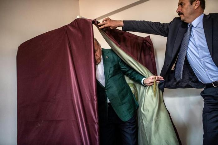 Turkish President Tayyip Erdogan said the killing of two men at a polling station in eastern Turkey "upset" him, and promised the culprits would face justice