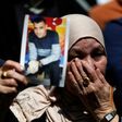 A woman holds the portrait of a Palestinian prisoner during a rally in the West Bank city of Ramallah on April 17, 2017 to show support to hundreds of hunger strikers in Israeli jails