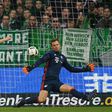 Bremen's midfielder Max Kruse (2L) scores against Bayern Munich's goalkeeper Manuel Neuer during the German first division Bundesliga football match of Werder Bremen vs FC Bayern Munich in Bremen , nothern Germany, on January 28, 2017
