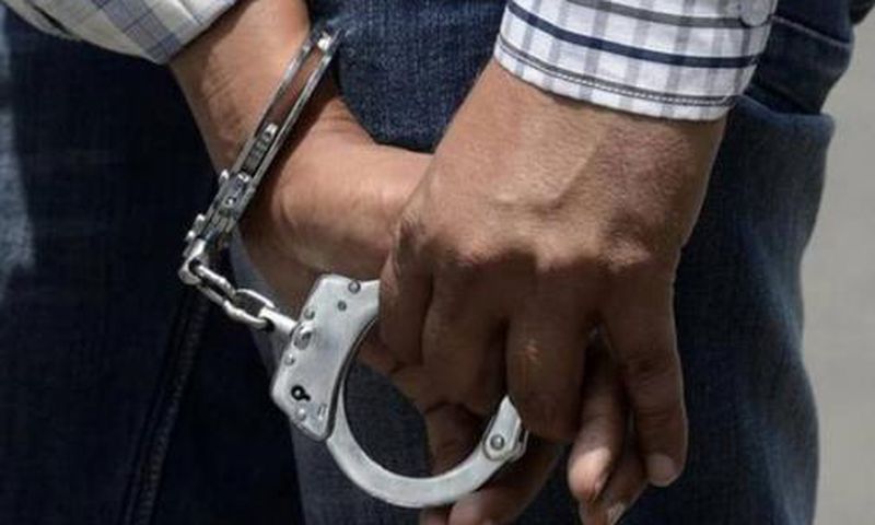 A criminal in handcuffs