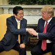 US President Donald Trump praised Japanese Prime Minister Shinzo Abe's "strong hands" after greeting him with a hug at the White House