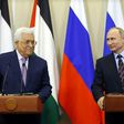 Russian President Vladimir Putin (R) and Palestinian leader Mahmud Abbas take part in a videoconference with Bethlehem following a meeting at the Bocharov Ruchei residence in the Black sea resort of Sochi on May 11, 2017