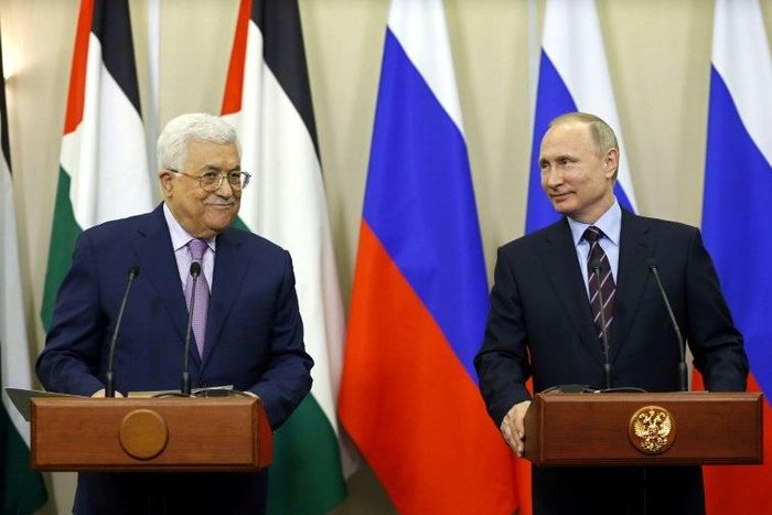 Russian President Vladimir Putin (R) and Palestinian leader Mahmud Abbas take part in a videoconference with Bethlehem following a meeting at the Bocharov Ruchei residence in the Black sea resort of Sochi on May 11, 2017