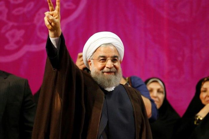 Iranian President Hassan Rouhani, who has comfortably won a second term, gestures during a campaign rally in Tehran on May 9, 2017