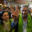 The Ecuadorean presidential candidate of the ruling Alianza PAIS party, Lenin Moreno, next to his wife Rocio Gonzalez (L), listens to the first results of the runoff election, in Quito on April 2, 2017