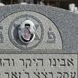 Vandalized stones are scattered at Stone Road or Waad Hakolel Cemetery in Rochester, New York on March 3, 2017