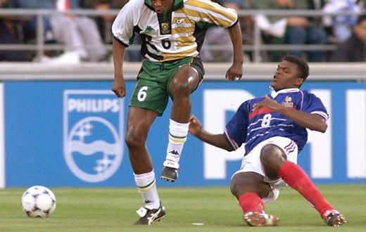 Marcel Desailly of France tackles Philemon Masinga (L) of South Africa during a 1998 World Cup group match in Marseille