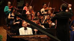 A pianist swings hard in both classical and jazz