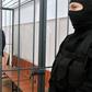 Nikita Belykh, accused by Russia's Investigative Committee of accepting a bribe of 400,000 euros ($430,800), stands inside a defendants' cage during a hearing at the Basmanny district court in Moscow on June 25, 2016