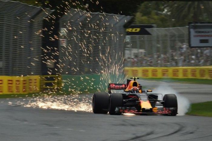 Sparks fly from beneath the car as Red Bull's Australian driver Daniel Ricciardo takes part in the qualifying session for the Formula One Australian Grand Prix in Melbourne on March 25, 2017