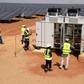 Technicians operate electrical cabinets on October 22, 2016 during the opening ceremony of a new photovoltaic energy production site in Bokhol