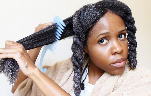 Detangling hair extensions with wide tooth comb