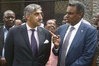 Queen's Counsel Khawar Qureshi chats with Director of Public Prosecutions Noordin Haji