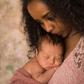 Mom holding baby(Mothering)