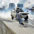 Demonstrators scatter as a National Guard riot control vehicle charges during a protest in Caracas, on May 10, 2017