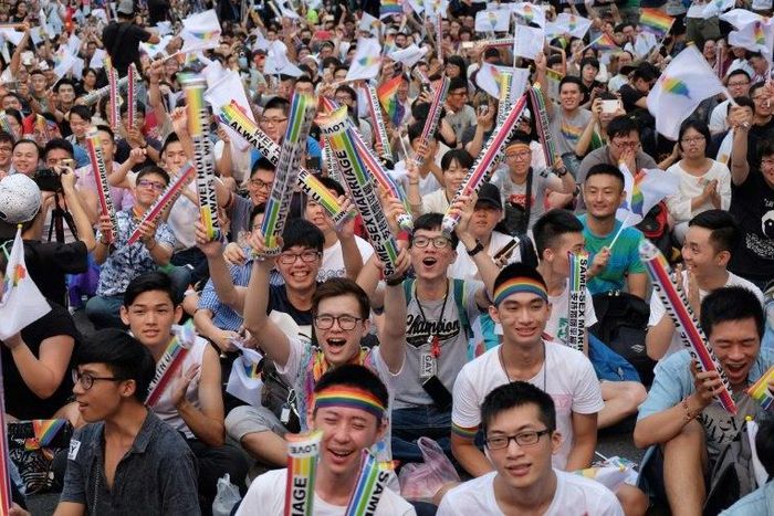 Same-sex activists cheered, hugged and wept outside the parliament in Taipei as they celebrated the landmark decision