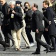 French President Francois Hollande walks with president-elect Emmanuel Macron at a ceremony marking the 72nd anniversary of the victory over Nazi Germany during World War II
