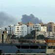 Smoke rises in the centre of the Libyan capital of Tripoli after the clashes on May 26, 2017
