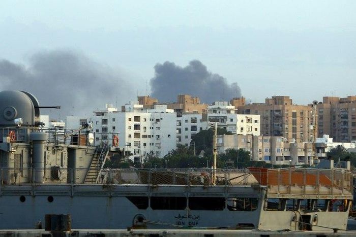 Smoke rises in the centre of the Libyan capital of Tripoli after the clashes on May 26, 2017