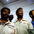 (L to R) Indians Midhun Ganesh and Edward Ambrose and Pakistani Ayaz Hussein Jamali, look on upon their arrival at Khartoum airport on March 30, 2017