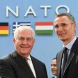 NATO Secretary General Jens Stoltenberg (R) greets US Secretary of State Rex Tillerson who called on alliance allies to meet their funding pledge